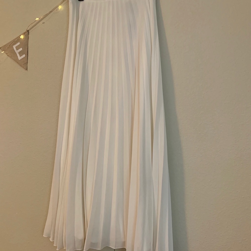 Long creamy white skirt. New with tags. Size 8